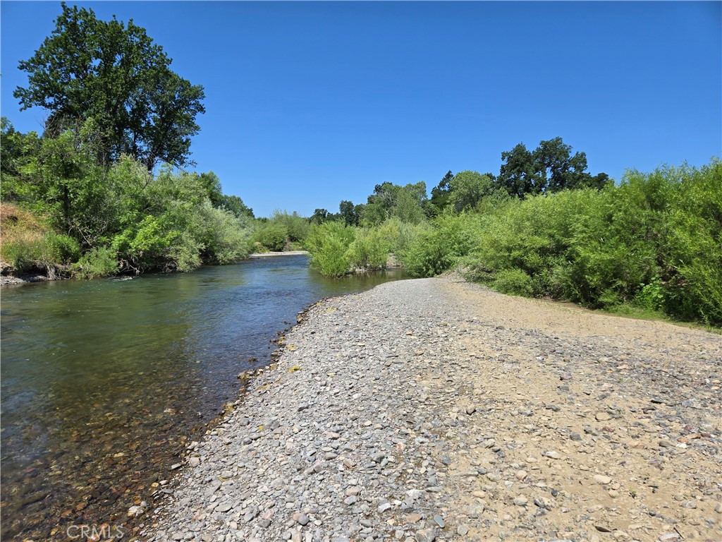 16685 Tehama Dam Road Cottonwood, CA 96022 - Photo 3 of 19 a view of a lake with a mountain in the background