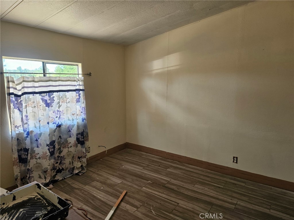 16685 Tehama Dam Road Cottonwood, CA 96022 - Photo 9 of 19 a view of a room with wooden floor