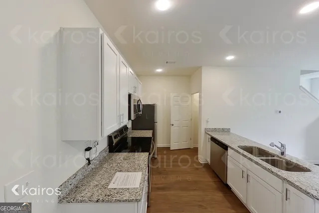 a kitchen with a sink and a refrigerator