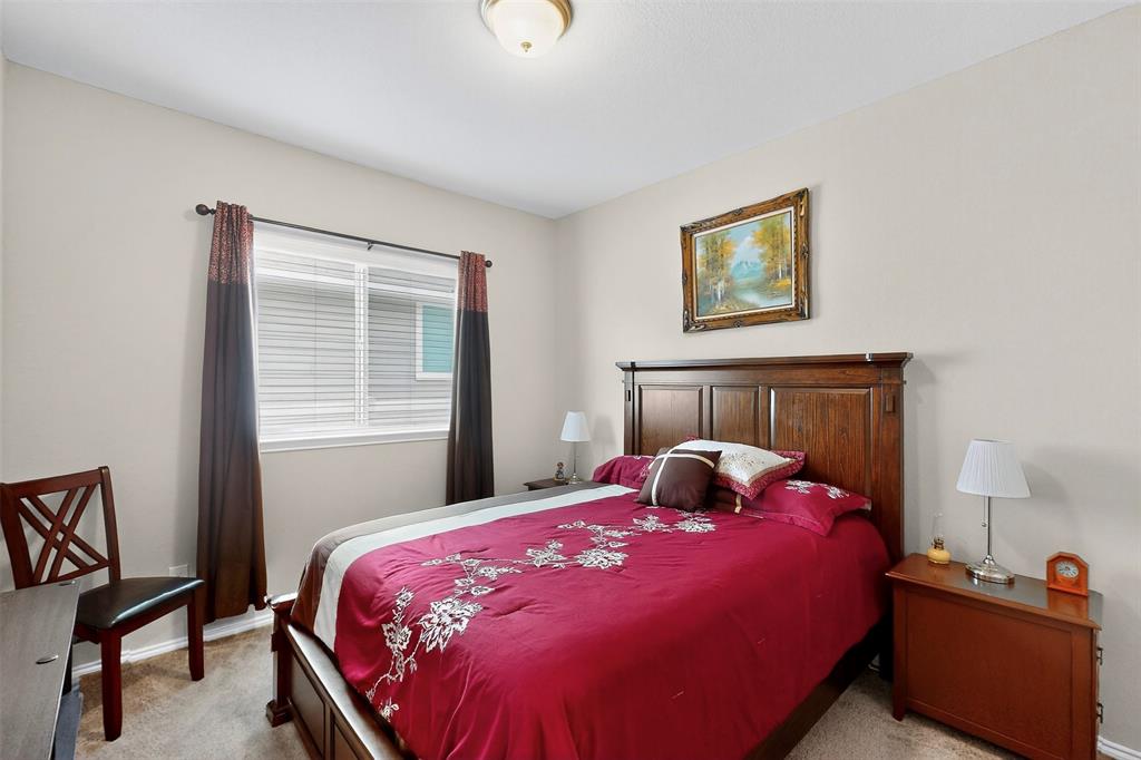 1712 Intervale Road Providence Village, TX 76227 - Photo 33 of 39 a bedroom with a bed and a window