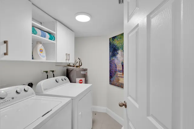 a view of storage and utility room with washer and dryer