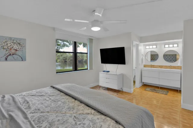 a bedroom with furniture and flat screen tv