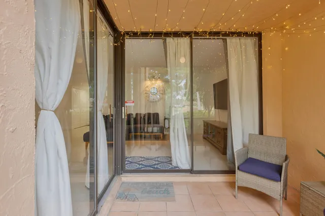 a view of a glass door and the porch