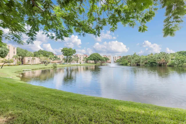 a view of a lake with houses in the background