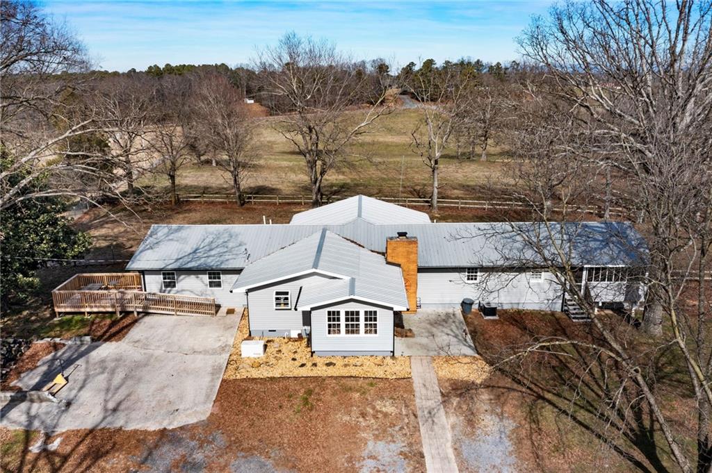 1813 Boone Ford Road Southeast Calhoun, GA 30701 - Photo 1 of 1 an aerial view of a house with a yard