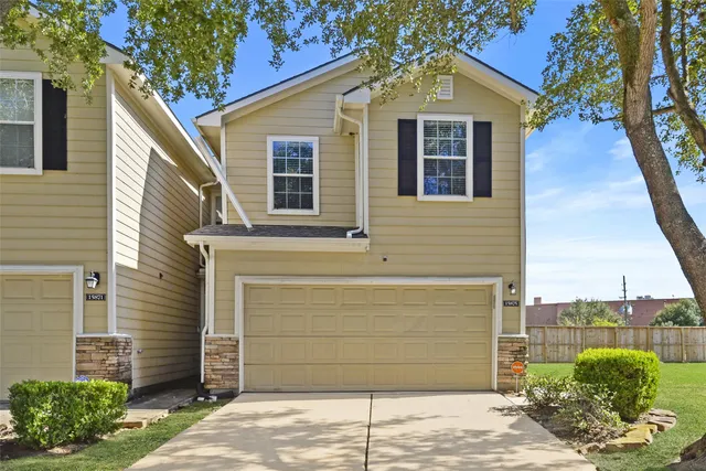 a view of a house with a garage
