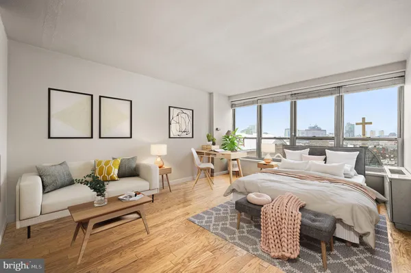 a living room with furniture and a large window