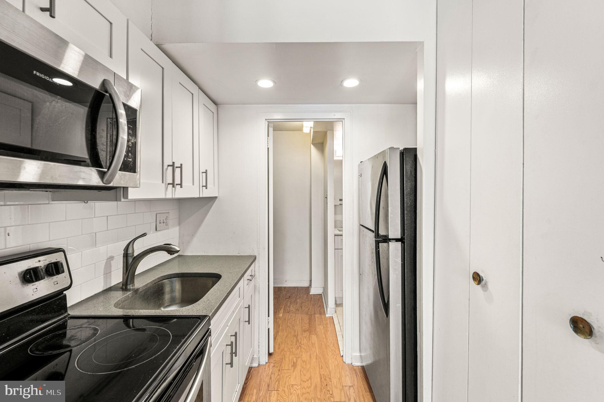 224 West Rittenhouse Square, Unit 915B Philadelphia, PA 19103 - Photo 6 of 21 Kitchen to the bathroom