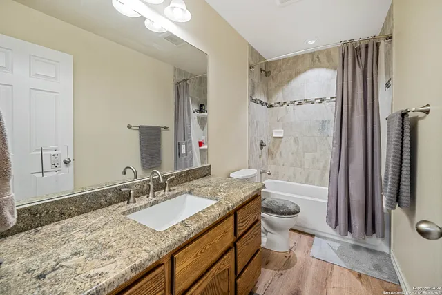 an aerial view of a house with a lake view