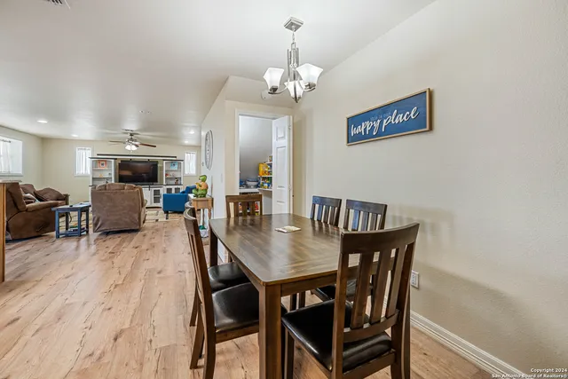 a kitchen with a refrigerator and cabinets