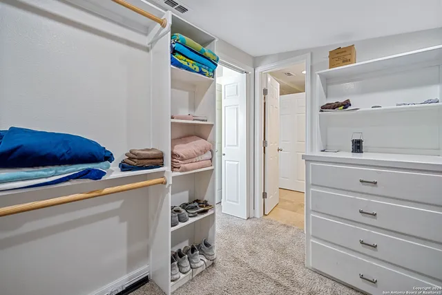 a bathroom with a granite countertop sink a shower and a mirror