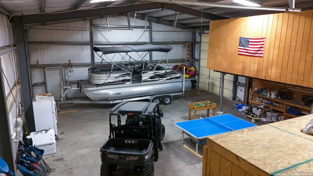 an aerial view of a houses with a lake view