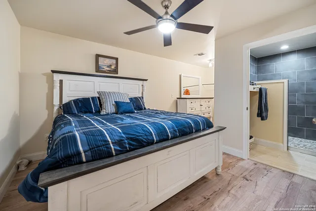 a bedroom with bed and window