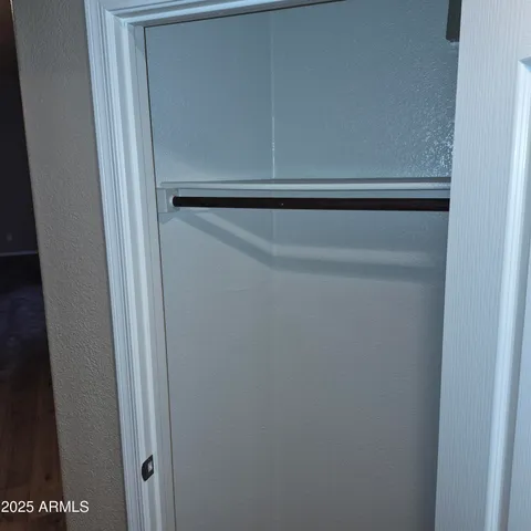 a view of a small space with racks on the wall