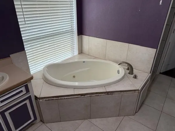 a bathroom with a toilet sink and shower