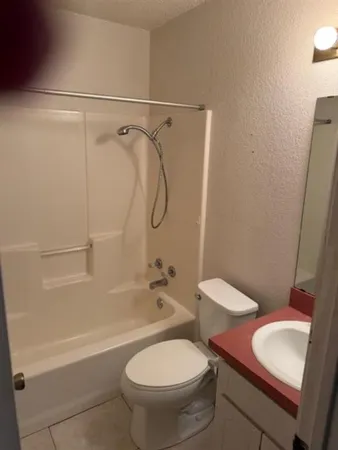 a kitchen with stainless steel appliances a refrigerator and a stove top oven