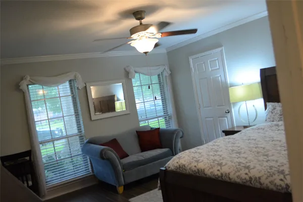 a bedroom with bed and window