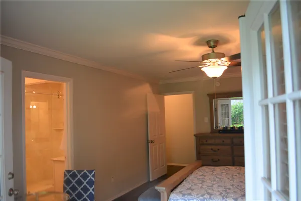 a view of a hallway view with wooden floor and staircase