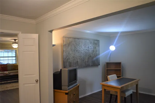 a workspace with furniture and mirror