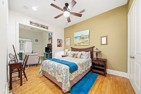 a bedroom with a bed and a table in it