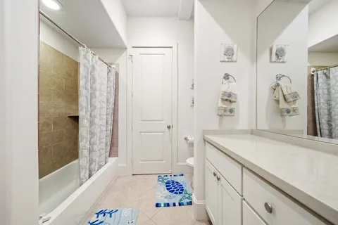 a bathroom with a sink and a shower