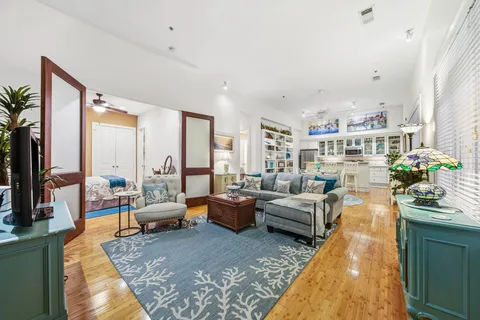 a living room with furniture and a large window