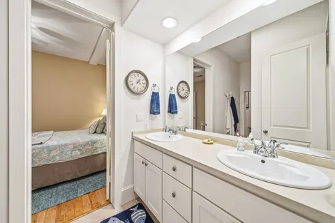 a en suite bathroom with a sink and a mirror