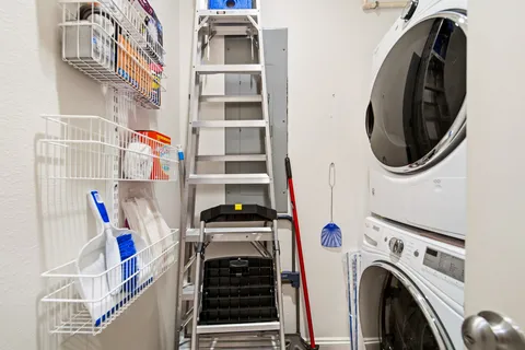 a view of storage and utility room with washer and dryer