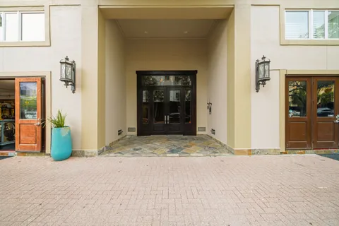 front view of a brick house with a outdoor space