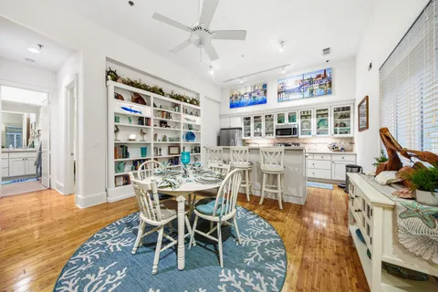 a view of a dining room with furniture and wooden floor