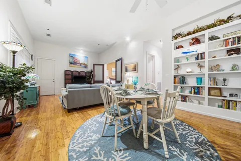 a view of a dining room with furniture and a kitchen