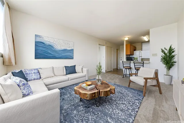 a living room with furniture and a rug