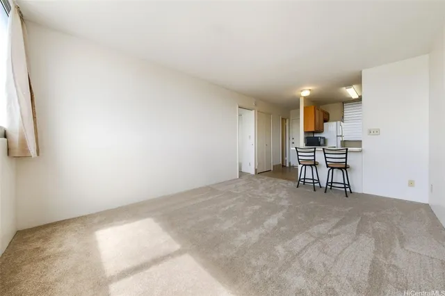 a view of a livingroom with furniture and window