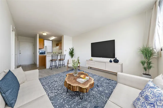 a living room with furniture and a flat screen tv