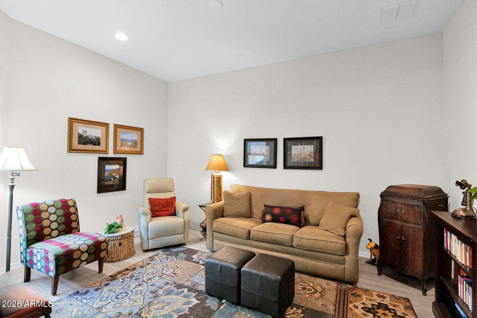 7723 West Willow Way Florence, AZ 85132 - Photo 29 of 64 a living room with furniture and a couch