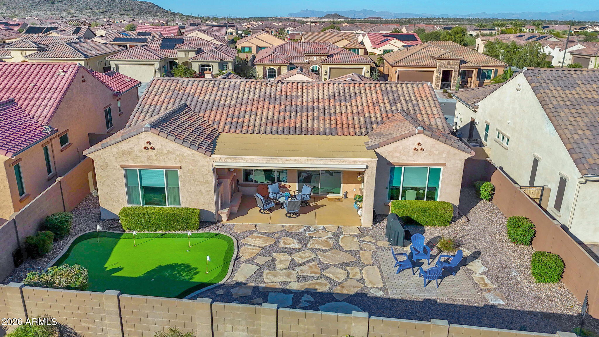 7723 West Willow Way Florence, AZ 85132 - Photo 45 of 64 an aerial view of a house with a yard and potted plants