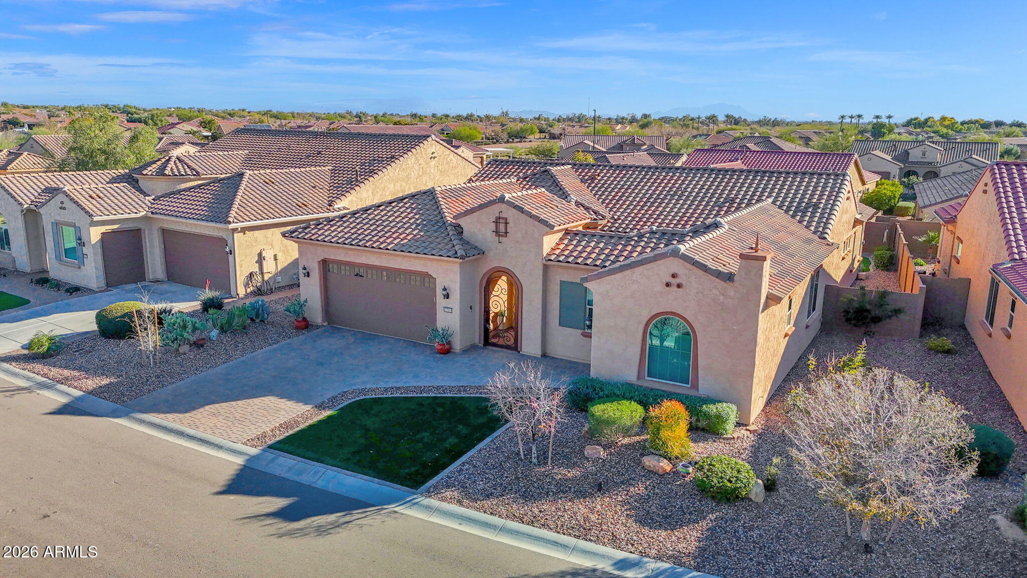 7723 West Willow Way Florence, AZ 85132 - Photo 51 of 64 an aerial view of a house with a garden and mountain view