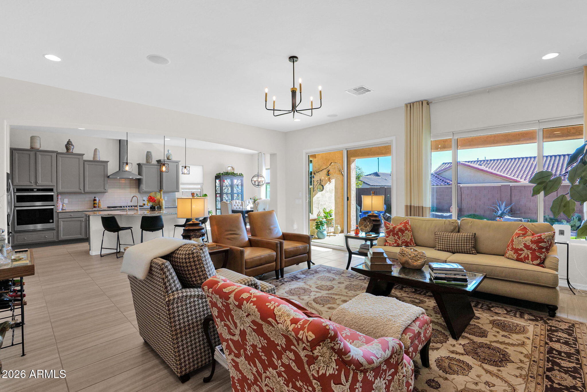 7723 West Willow Way Florence, AZ 85132 - Photo 5 of 64 a living room with furniture fireplace and a large window