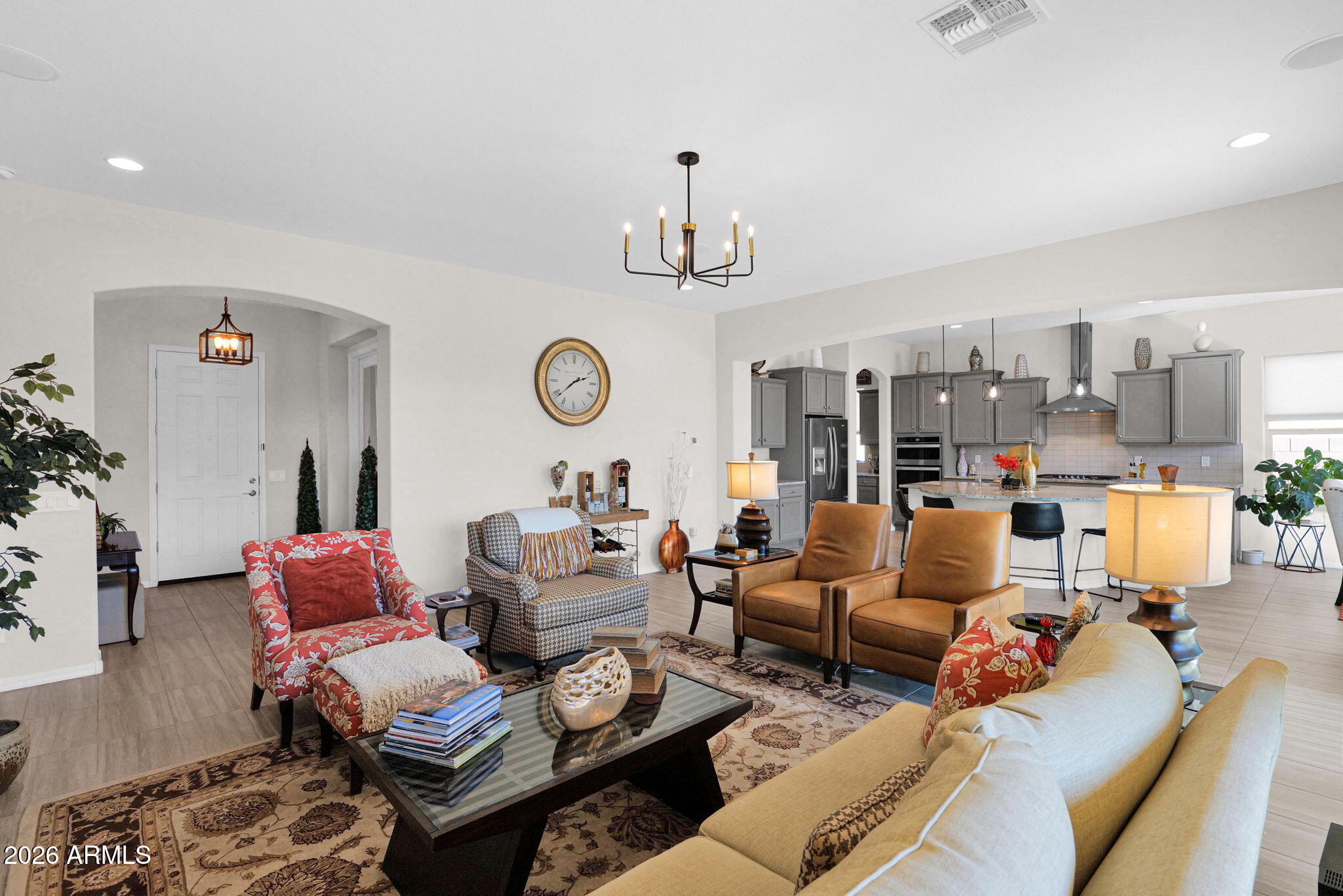 7723 West Willow Way Florence, AZ 85132 - Photo 9 of 64 a living room with furniture and a chandelier