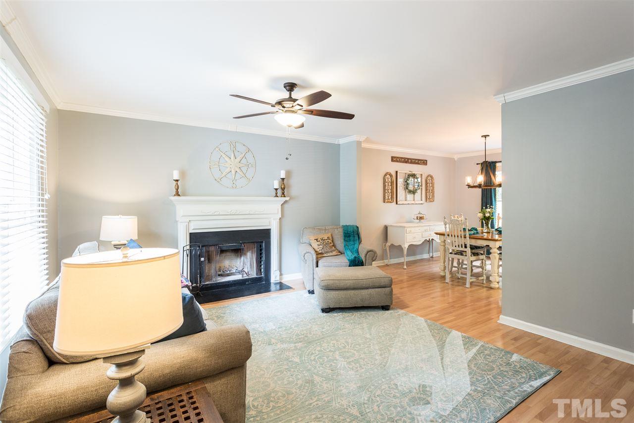 3533 Tunas Street Raleigh, NC 27616 - Photo 13 of 30 a living room with furniture and a fireplace
