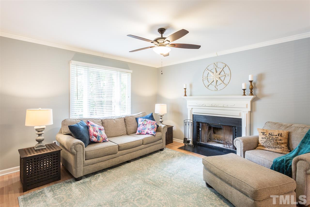3533 Tunas Street Raleigh, NC 27616 - Photo 14 of 30 a living room with furniture and a fireplace