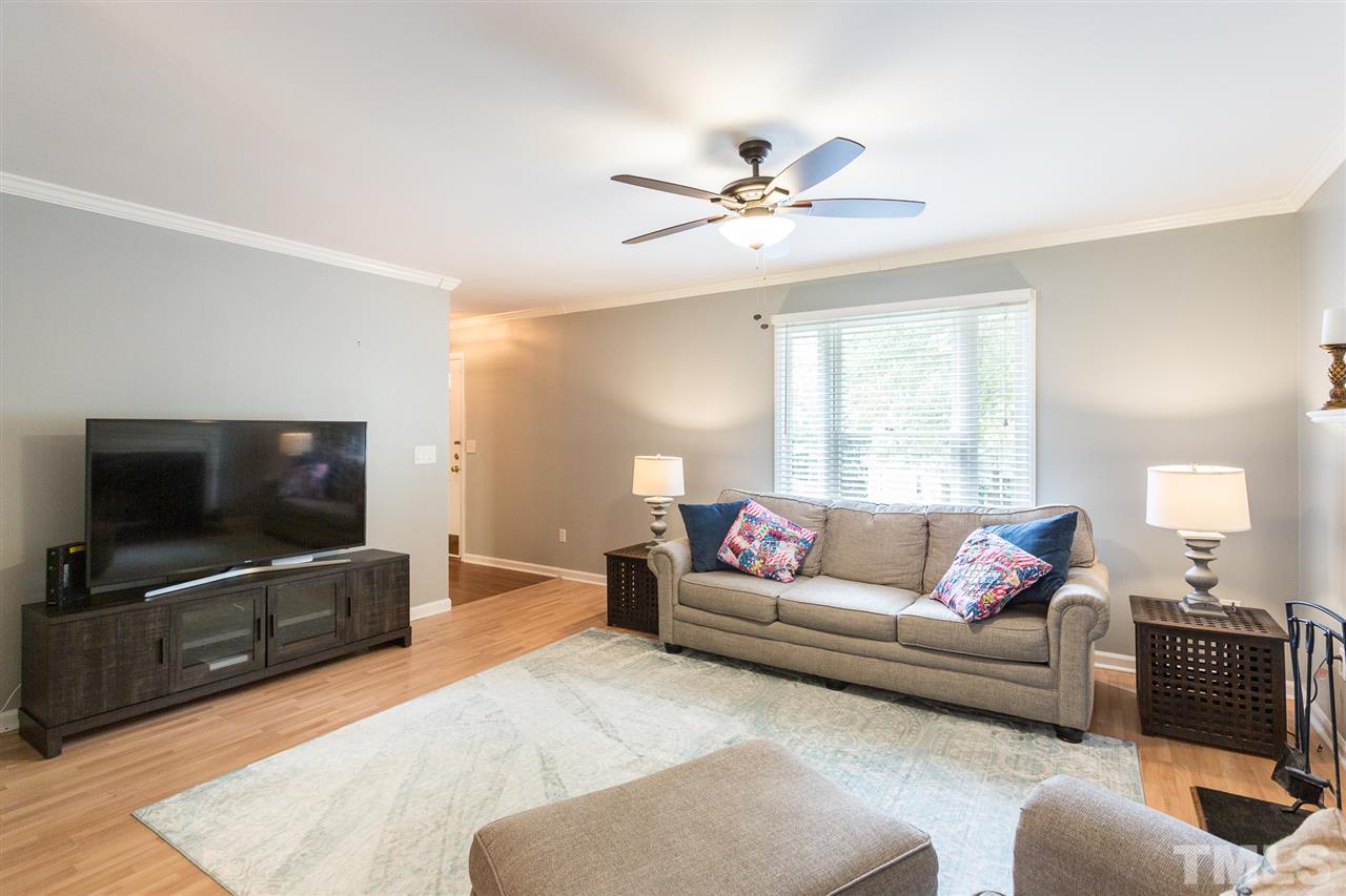 3533 Tunas Street Raleigh, NC 27616 - Photo 15 of 30 a living room with furniture and a flat screen tv