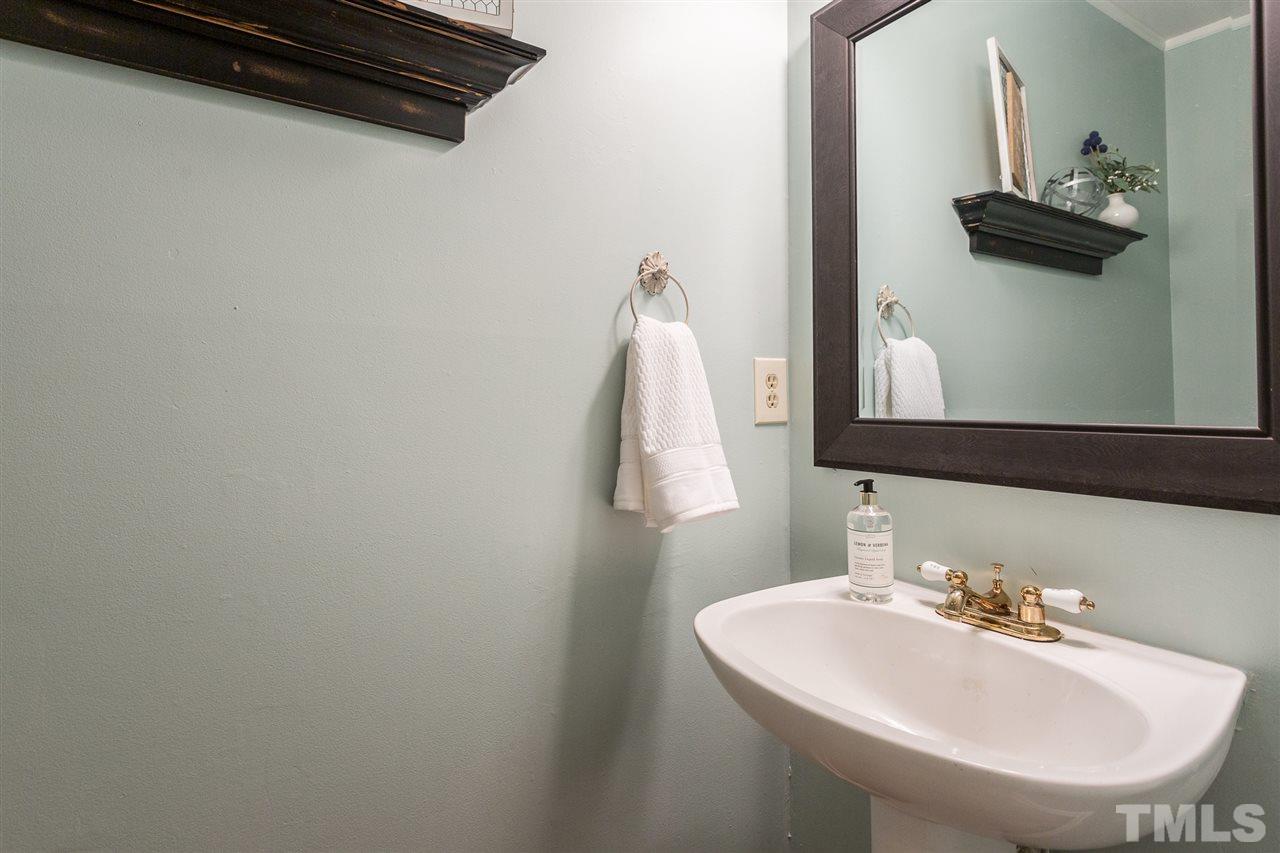 3533 Tunas Street Raleigh, NC 27616 - Photo 24 of 30 a bathroom with a sink and a mirror