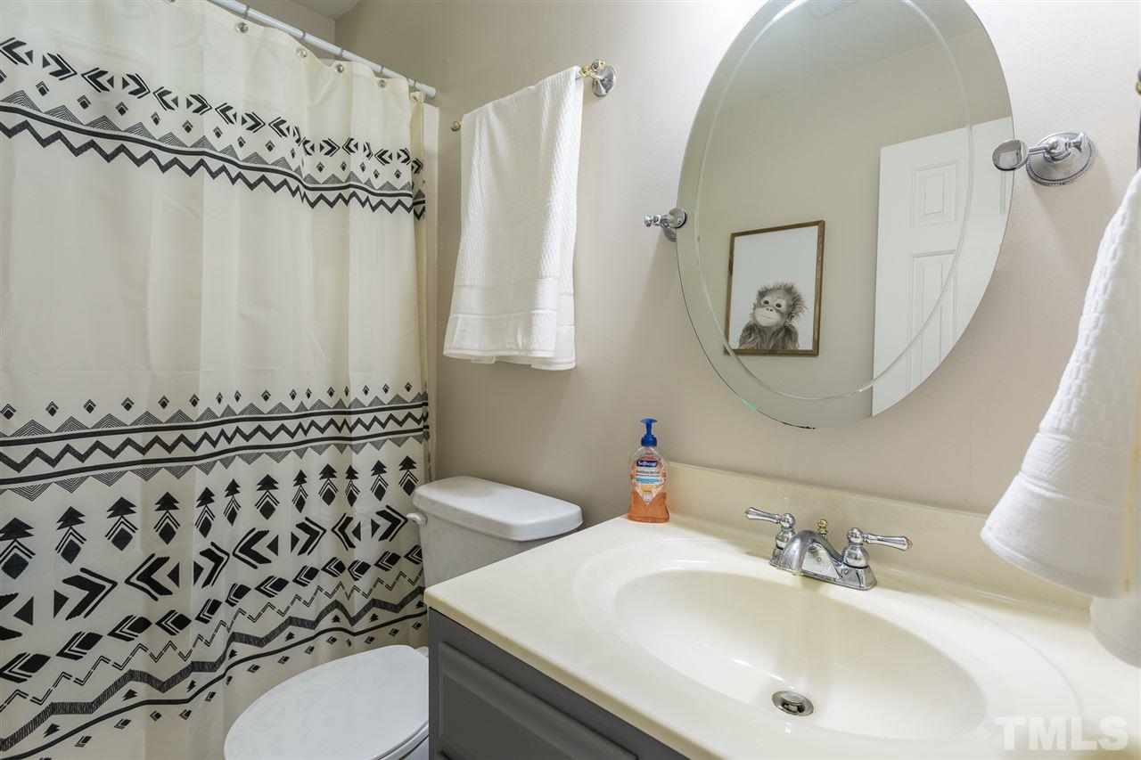 3533 Tunas Street Raleigh, NC 27616 - Photo 30 of 30 a bathroom with a sink and a mirror