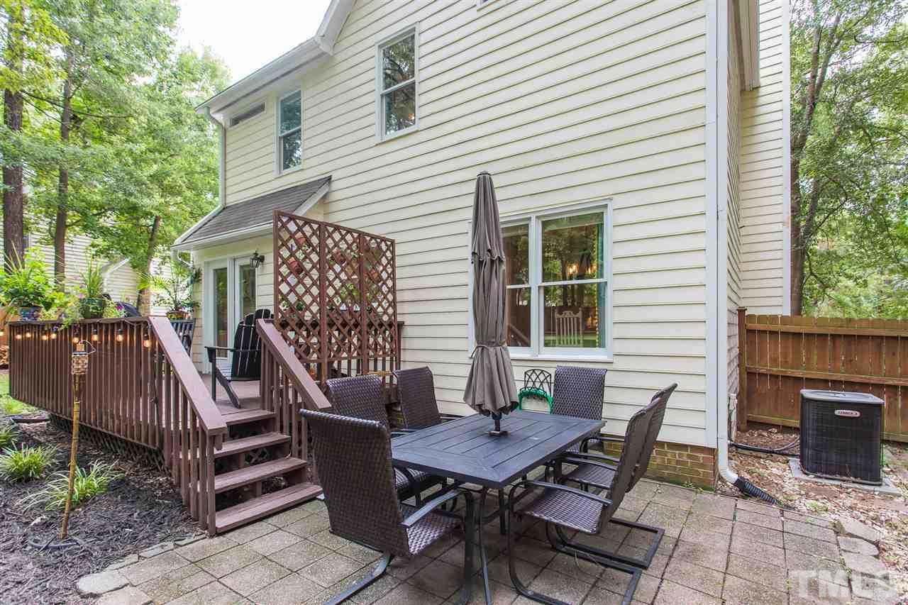 3533 Tunas Street Raleigh, NC 27616 - Photo 5 of 30 a view of a deck with table and chairs with wooden floor and fence