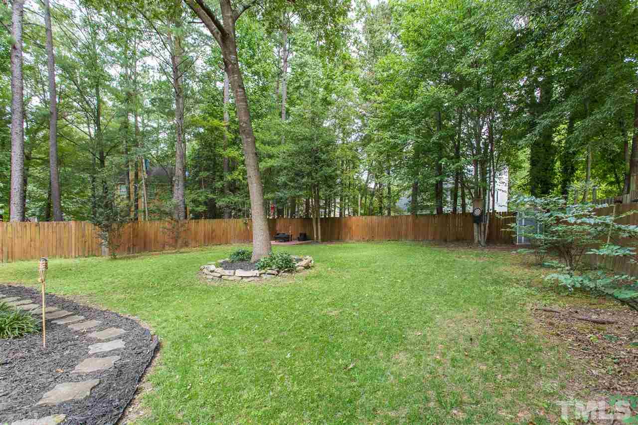3533 Tunas Street Raleigh, NC 27616 - Photo 9 of 30 a backyard of a house with lots of green space