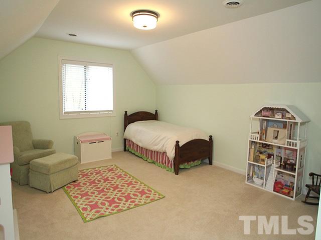 2409 Countrywood Road Raleigh, NC 27615 - Photo 14 of 25 Bonus room is currently used as bedroom as basement provides plenty of bonus room space.