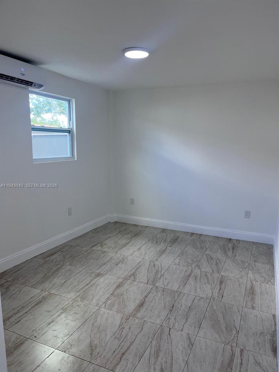 50 Northwest 68th Court, Unit 3 Miami, FL 33126 - Photo 5 of 9 a view of a room with an empty space