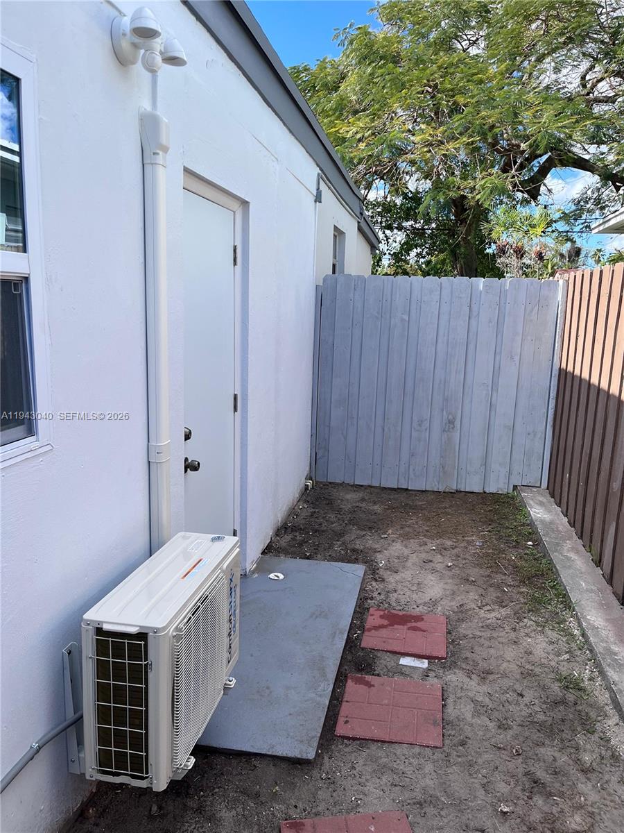 50 Northwest 68th Court, Unit 3 Miami, FL 33126 - Photo 9 of 9 a room with a chair and yard