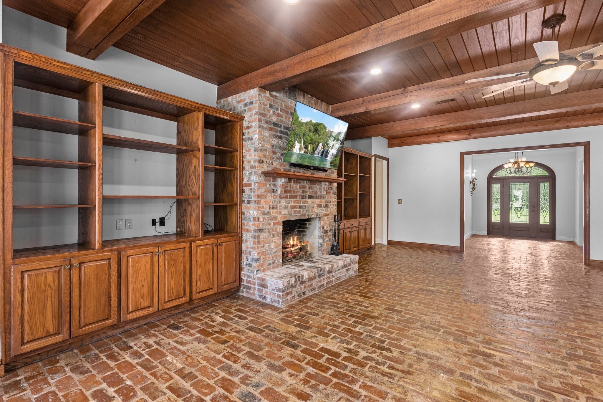 27076 Interstate 10 Winnie, TX 77665 - Photo 15 of 42 a view of a livingroom with a fireplace and cabinet